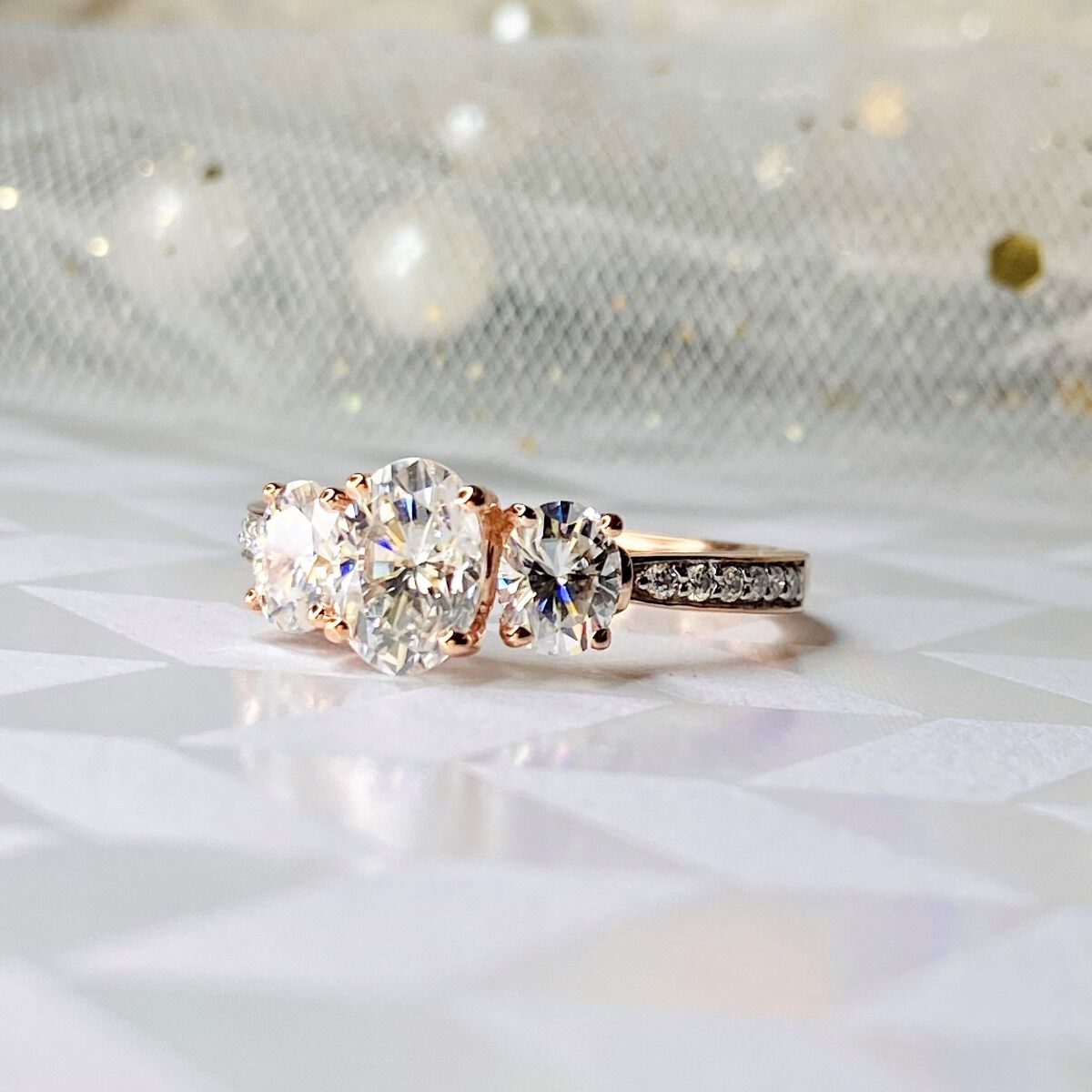 Rose gold three 2025 stone engagement ring